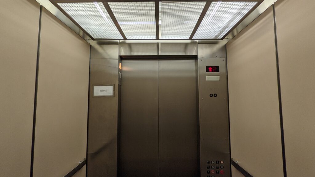 Ana Sayfa interior of a vintage montgomery elevator with a modified controller